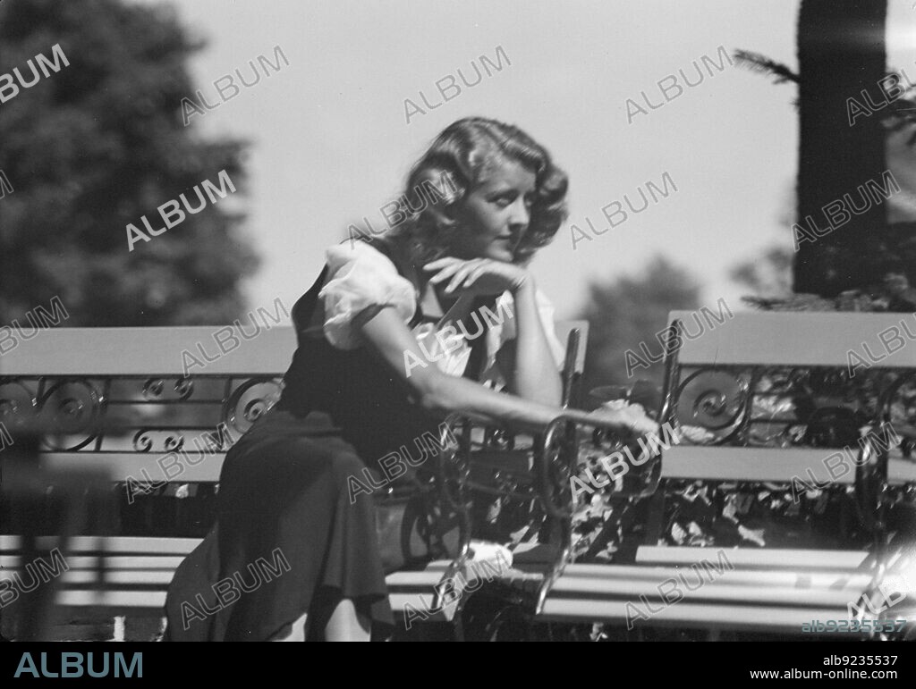 ARNOLD GENTHE. Roelof, Wilma, Miss, seated outdoors, 1932 July.