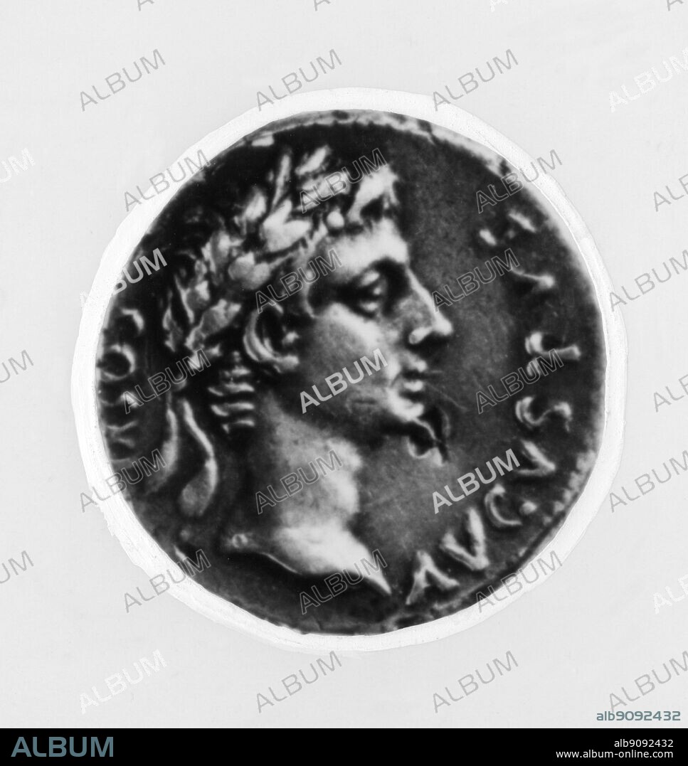 Augustus son of the deified Caesar wearing the laurel wreath an attribute of the gods. Roman Coin.