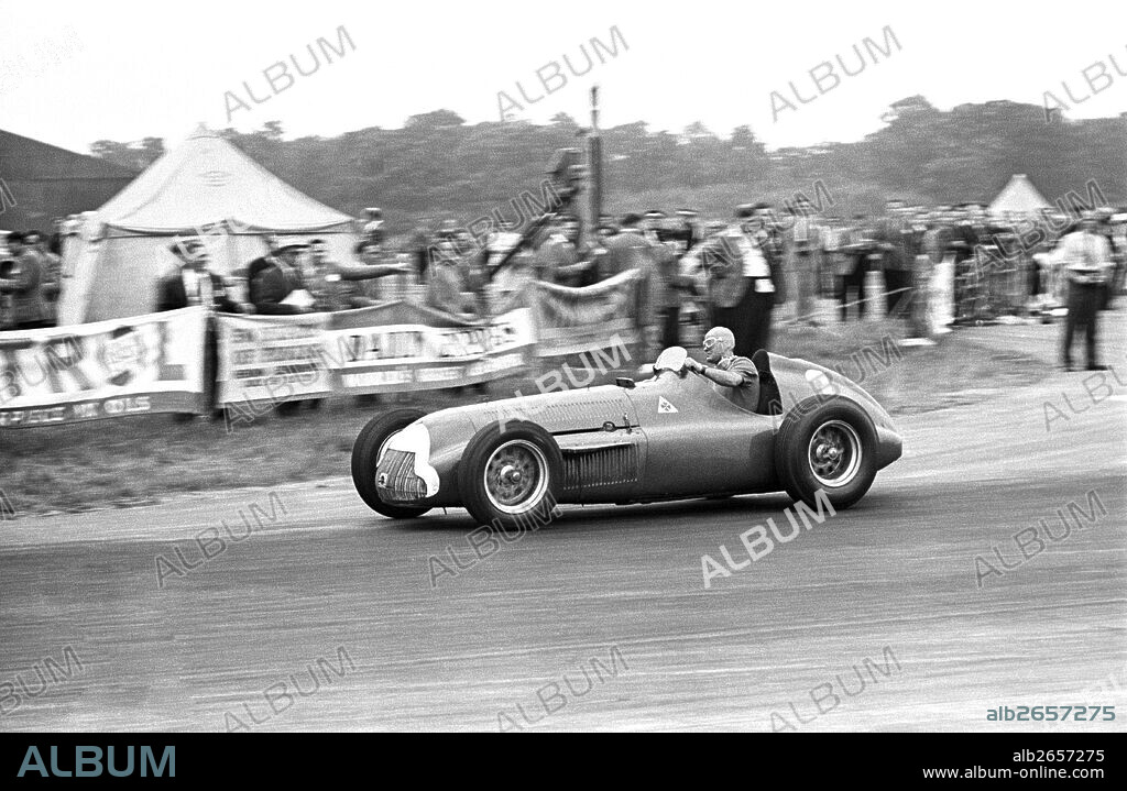 Consalvo Sanesi, chief test driver for Alfa Romeo who also drove in races, here in an Alfetta finishing 6th at the British Grand Prix Silverstone, England, 14th July 1951.