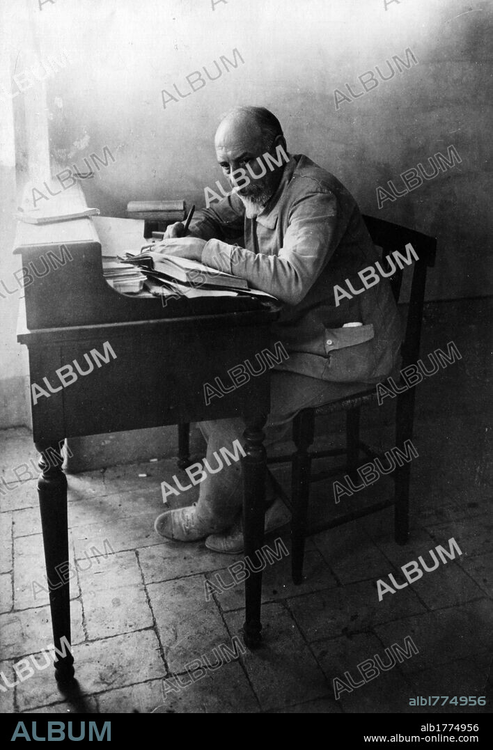 Luigi Pirandello in his studio. Luigi Pirandello, Italian dramatist, writer and poet, seated at the desk of his study. Monteluco, 1924.