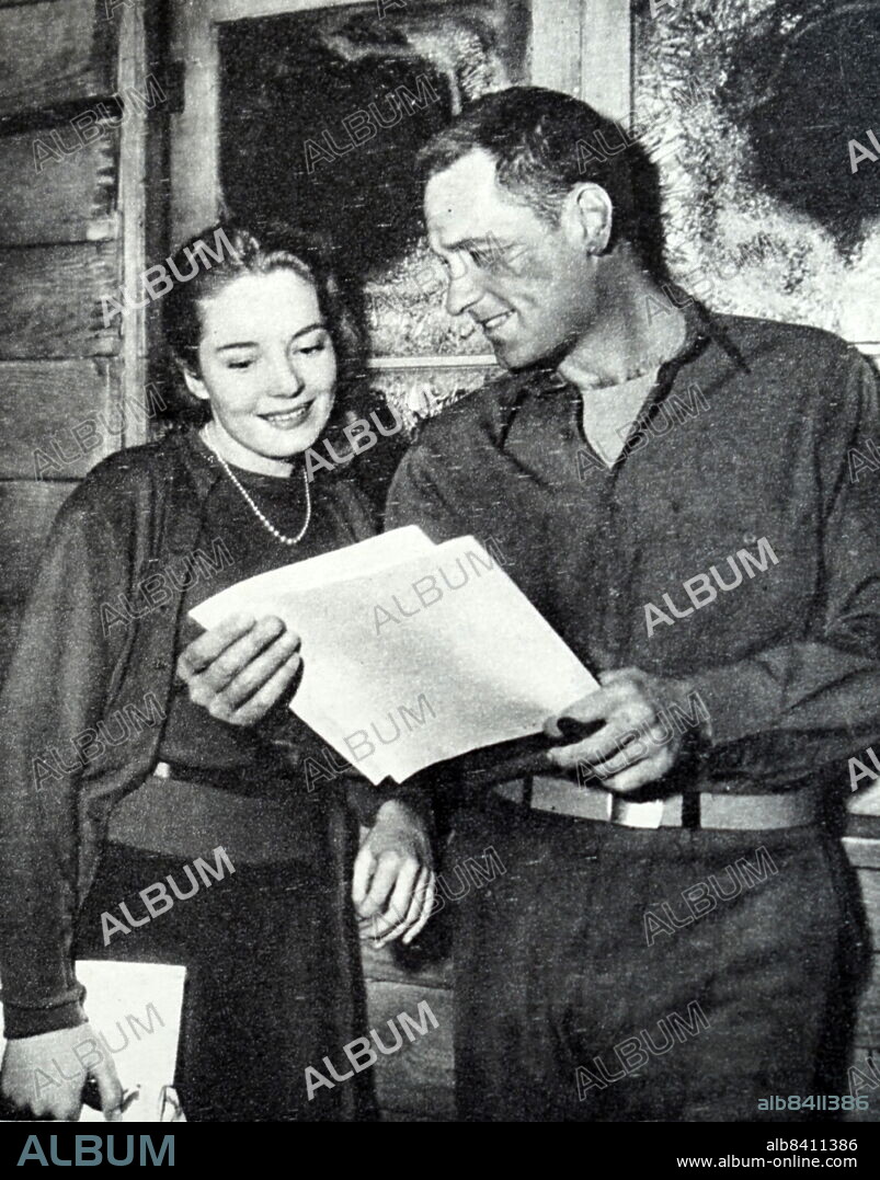 Billy Wilder and Suzanne Cloutier on the set of Stalag 17 is a 1953 American war film. Billy Wilder (born Samuel Wilder; June 22, 1906 - March 27, 2002) was an Austrian-American film director, producer and screenwriter. Suzanne Cloutier (July 10, 1923 - December 2, 2003) was a Canadian film actress.