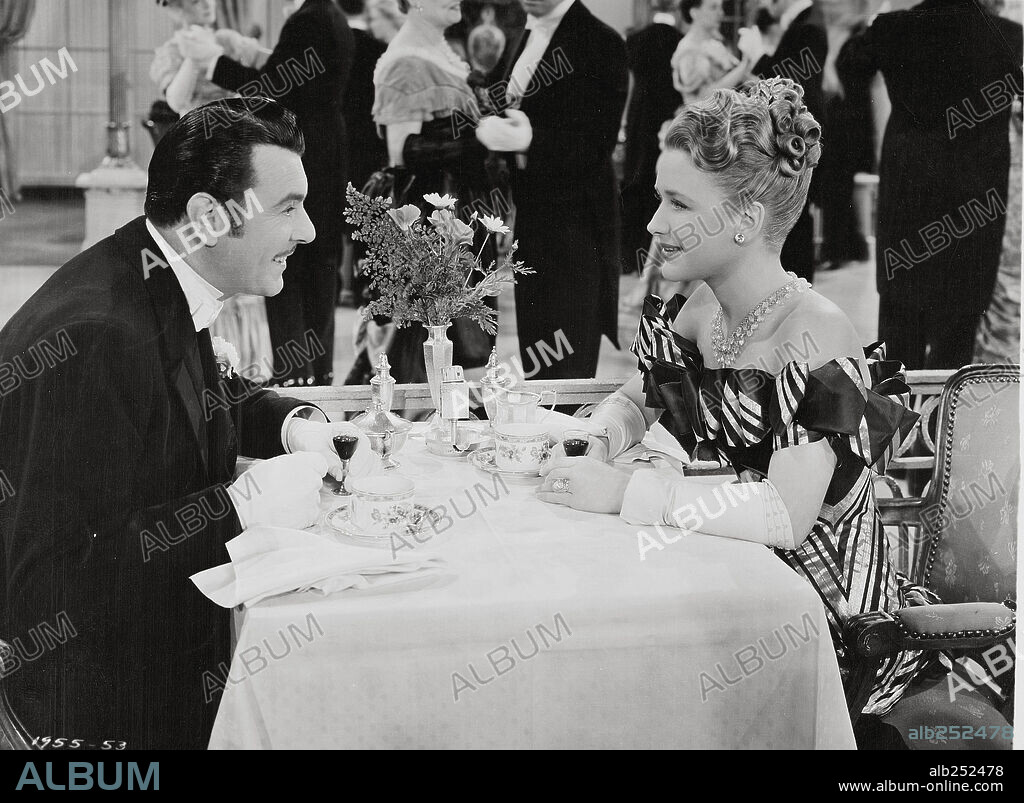 GEORGE BRENT and PRISCILLA LANE in SILVER QUEEN, 1942, directed by LLOYD BACON. Copyright UNITED ARTISTS.