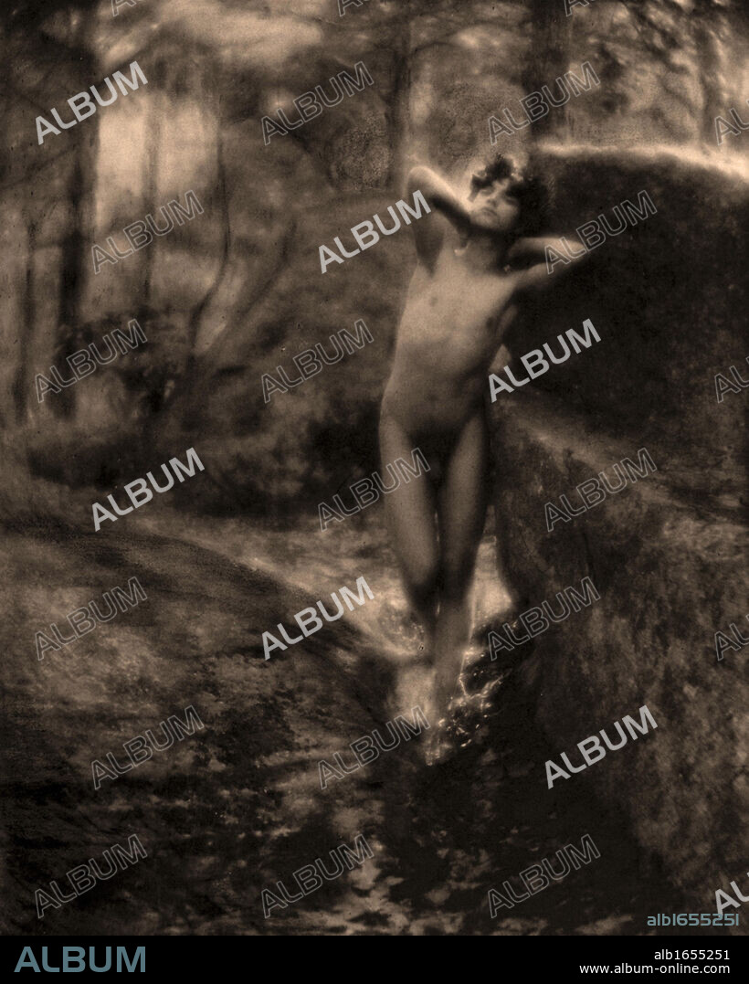 Nude Male Standing', c1890. Fred Holland Day (1864-1933) American photographer and publisher. Youth in a rocky landscape. Soft Focus.