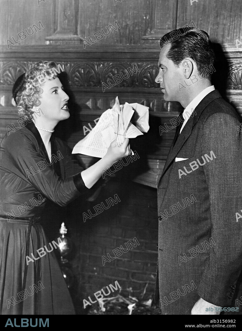 BARBARA STANWYCK and WILLIAM HOLDEN in EXECUTIVE SUITE, 1954, directed by ROBERT WISE. Copyright M.G.M.