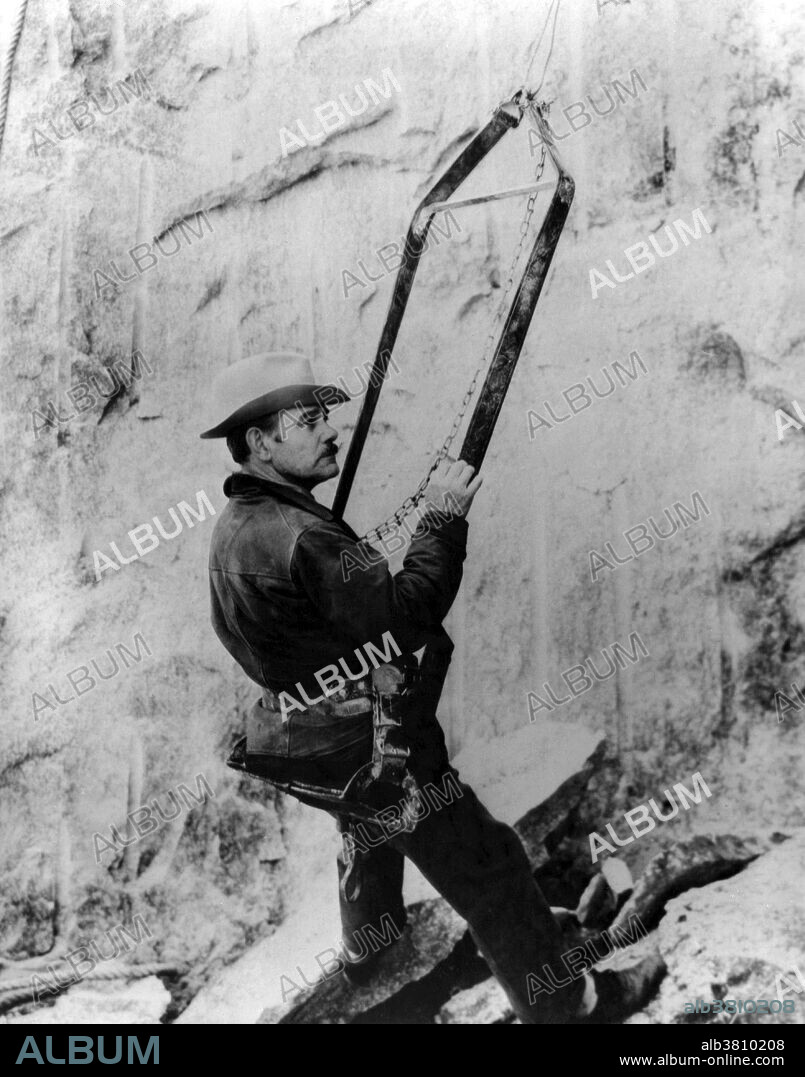 Borglum in a Bosun's chair inspecting the work on the memorial. Workers used the Bosun's chairs, suspended from above, while they drilled with jackhammers into the granite. John Gutzon de la Mothe Borglum (March 25, 1867 - March 6, 1941) was a Danish-American artist and sculptor famous for creating the monumental presidents' heads at Mount Rushmore, South Dakota; the famous carving on Stone Mountain near Atlanta; and other public works of art. He died in 1941 at the age of 73. Mount Rushmore National Memorial is a sculpture carved into the granite face of Mount Rushmore near Keystone, South Dakota. Sculpted by Borglum and his son, Lincoln Borglum, Mount Rushmore features 60 foot sculptures of the heads of four United States presidents: George Washington, Thomas Jefferson, Theodore Roosevelt, and Abraham Lincoln. Construction on the memorial began in 1927, and the presidents' faces were completed between 1934 and 1939. Although the initial concept called for each president to be depicted from head to waist, lack of funding forced construction to end in late October 1941. Mount Rushmore has become an iconic symbol of the United States, and attracts over three million visitors annually. NPS, no photographer credited, undated.