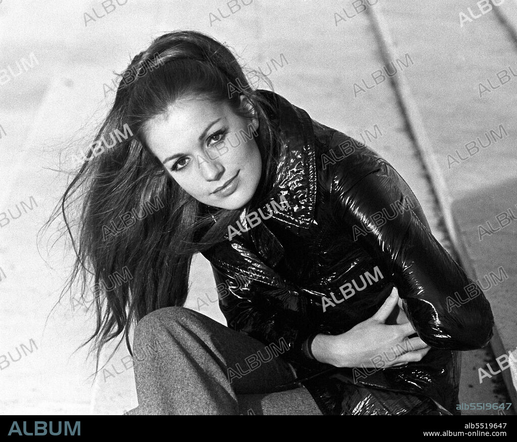 CATHERINE SPAAK. April 18, 2022: Actress CATHERINE SPAAK has died, aged 77, Italian media has reported. Born in France to a Belgian family, Spaak became famous in Italy as an actress, singer, television presenter and dancer. FILE PHOTO SHOT IN 1969: French-born Italian actress and singer CATHERINE SPAAK Catherine Spaak posing on a staircase wearing a shiny raincoat at the EUR district in Rome, Italy, 1969. (Credit Image: © Marisa Rastellini/Mondadori Portfolio via ZUMA Press).