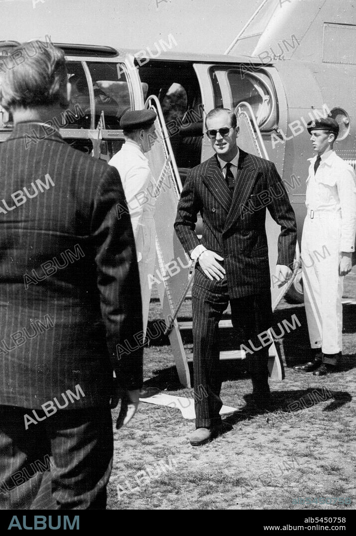 The Duke of Edinburgh arriving at Bisley to-day.The Duke of Edinburgh flew by helicopter to Bisley to-day. He presented the King George V Cup to Devon team, and medals to Sussex and Middlesex who were second and third. July 9, 1954. (Photo by Daily Mail Contract Picture).
