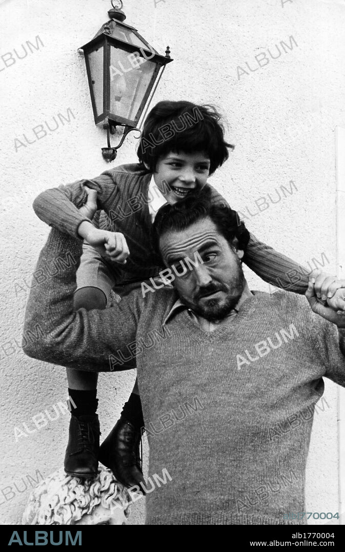 Vittorio Gassman with his son Alessandro. Italian actor Vittorio Gassman playing with his son Alessandro. 1972.
