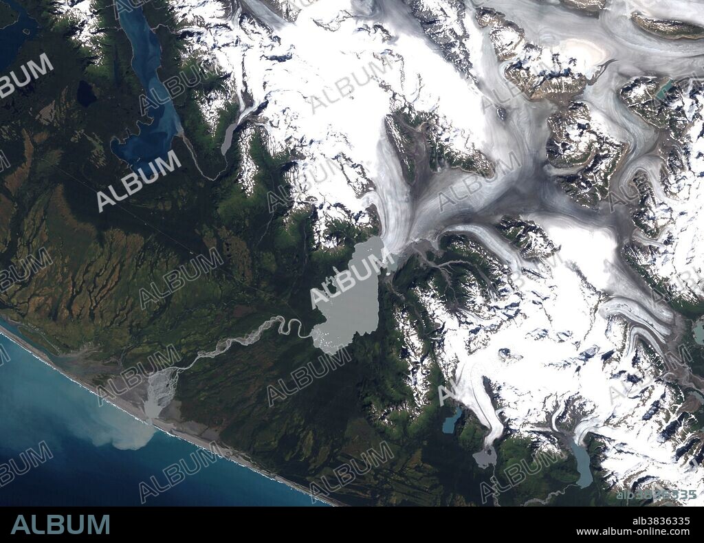 Located in the Brabazon Range of southeastern Alaska, Yakutat Glacier is one of the fastest retreating glaciers in the world. It is the primary outlet for the 810-square kilometer (310-square mile) Yakutat ice field, which drains into Harlequin Lake and, ultimately, the Gulf of Alaska. The Thematic Mapper on Landsat 5 acquired the image on August 22, 1987. Snow and ice appear white and forests are green. The brown streaks on the glaciers are lateral and medial moraines. Over the past 26 years, the glacier's terminus has retreated more than 5 kilometers (3 miles).
