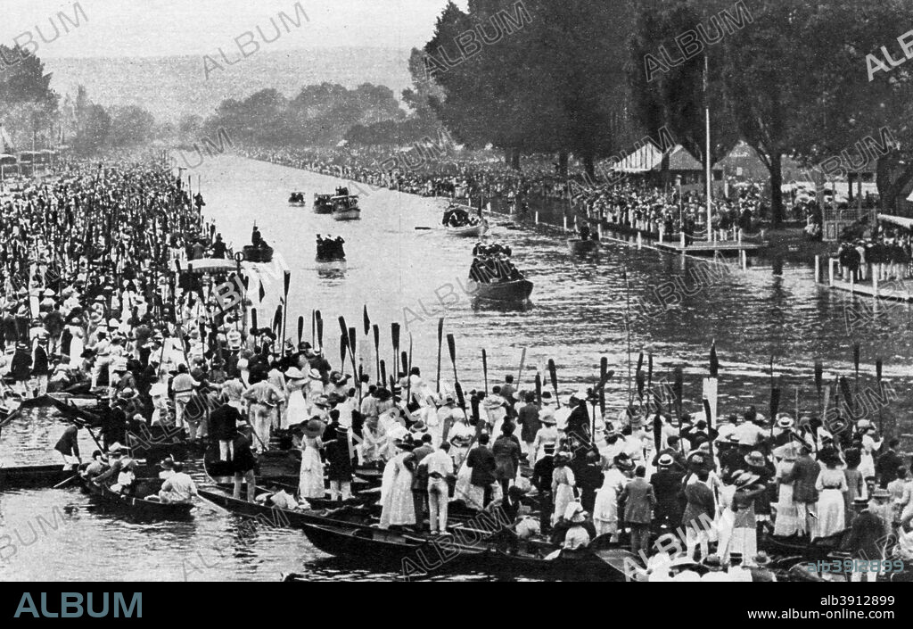 Henley Regatta, Oxfordshire, 6th July 1912 (1937). The royal barge, rowed by red-liveried watermen, bearing King George V, Queen Mary, and Princess Mary. This was the only time the king attended the regatta. A print from The Story of Seventy Momentous Years, the Life and Times of King George V, 1865-1936, editor Harold Wheeler, Odhams Press Ltd, London, 1937.