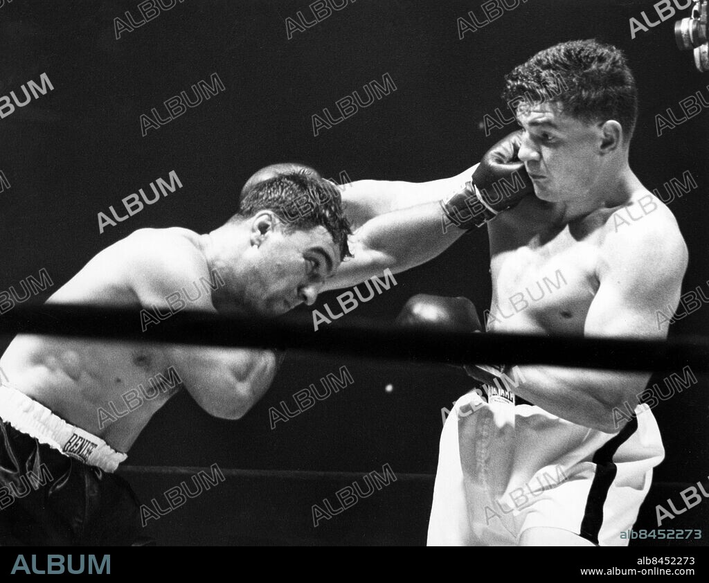 Utan bildtext. Anm. Rocky Marciano vinner över Rex Layne i Madison Square Garden, på Knock Out i 6:e ronden. Se även BAG997 i samma serie. persons: Rocky Marciano ;Rex Layne sites: USA ;NEW YORK.