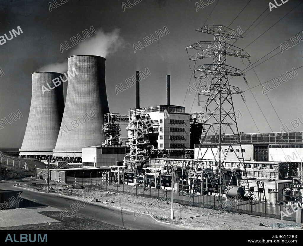 UKAEA. Calder Hall nuclear power station, Cumbria. Calder Hall, the world's first full scale commercial nuclear power station opened on 17 October 1956. On the left are the cooling towers and on the right a pylon carries transmission lines distributing electricity to the National Grid. Photograph UK Atomic Energy Authority.