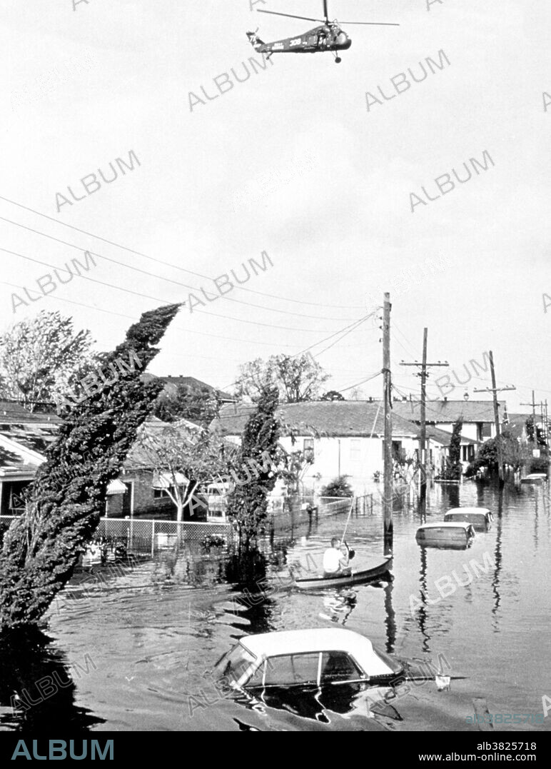 Helicopter hovers over flooded area following passage of Hurricane Betsy. 164,000 homes were flooded in this storm. Small loss of life as residents heeded warnings. New Orleans, Louisiana. September, 1965. Hurricane Betsy was a Category 4 hurricane of the 1965 Atlantic hurricane season which caused enormous damage in the Bahamas, Florida, and Louisiana. Betsy made its most intense landfall near the mouth of the Mississippi River, causing significant flooding of the waters of Lake Pontchartrain into New Orleans.