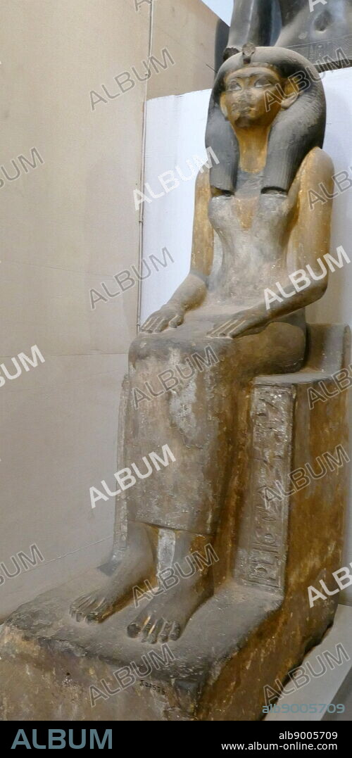 Painted sandstone statue of Queen Mut-Nofret, mother of King Tutmosis II.