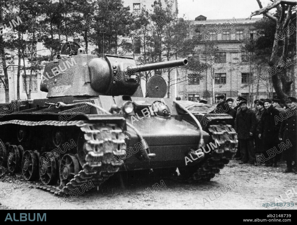 Kv-1 (klement voroshilov) tank, a group of civilians and red army men watch a new kv-1 tank that has just left the factory and will soon be on its way to the front, ussr, world war 2.