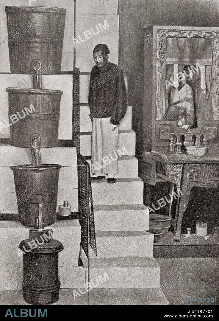 The Clepsydra or water clock of Canton, China.  This water clock was first made in about 1324, and was destroyed and restored many times. It was housed in the Double Gateway in the old city, Canton (Guangzhou).  Water dripped from one copper bucket to another, over a twelve hour period.  A float on the lowest bucket indicated the approximate time of day and this time was exhibited on a board outside the building.  From The Wonders of the World, published c.1920.