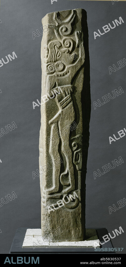 Stele 9 from Kaminaljuyu, Guatemala. A male figure, perhaps dancing, with belt, necklace and earplugs. The volute emanating from the mouth symbolizes song. Basalt (900-400 BCE), 154 x 22 cm. Pyramid C-III-6. Inv. 2359.