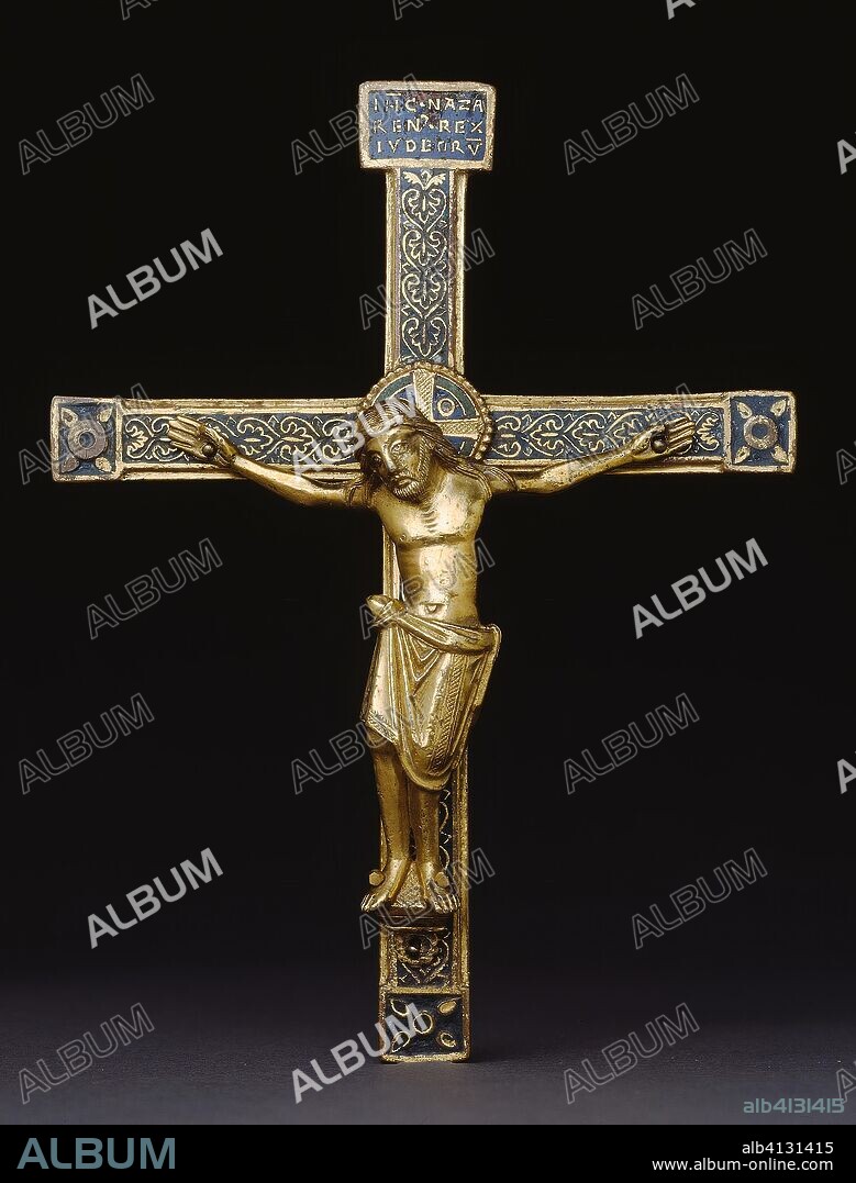 Crucifix. Mosan (Meuse River Valley) or; German (Rhineland). Date: 1140-1160. Dimensions: Overall to Spike: 21.9 × 13.2 cm (8 5/8 × 5 3/16 in.); Cross: 16.8 × 13.2 cm (6 5/8 × 5 3/16 in.); Corpus H: 9.8 cm (3 7/8 in.). Gilded copper, champlevé enamel. Origin: Meuse.