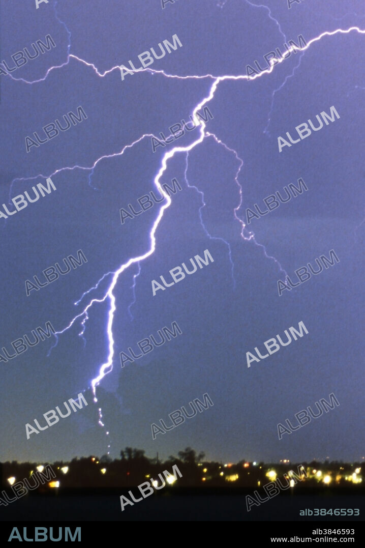 A rare photograph proves the existence of the phenomenon of bead lightning, shown in the lower left. Bead lightning is lightning which appears to break up into a string of beads. There are several theories that have been proposed to explain it. It is relatively rare. This is a time exposure photograph in which there are multiple cloud to ground lightning strikes from the cumulonimbus cloud or thunderstorm. All the bolts on the right display continuity to the ground, continuous illuminated channels, whereas the bead lightning does not exhibit this. If it was a form of cloud to ground lightning then the spaces between the beads would be filled with light like the normal ionized channel of a lightning bolt. For the definitive wide view of this photograph.