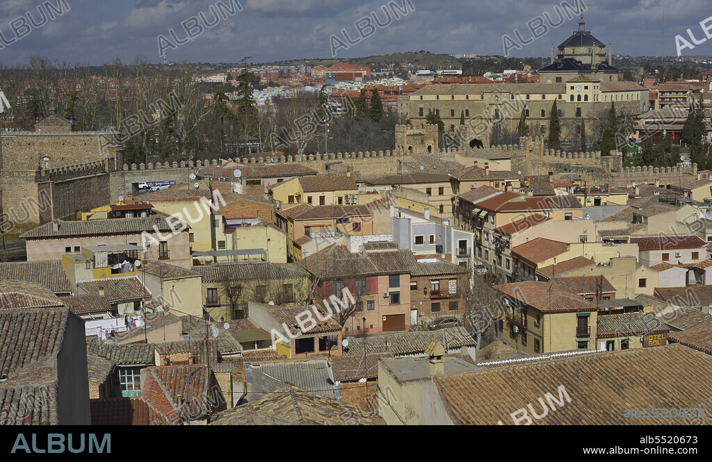 Toledo, Spain. Panoramic view of the city in which the Hospital of Tavera, built between 1541 and 1603, stands out. It was begun by Alonso de Covarrubias (1488-1570) and completed by Bartolomé Bustamante (1501-1570) in Renaissance style. On the left, New Bisagra Gate (Puerta Nueva de Bisagra).