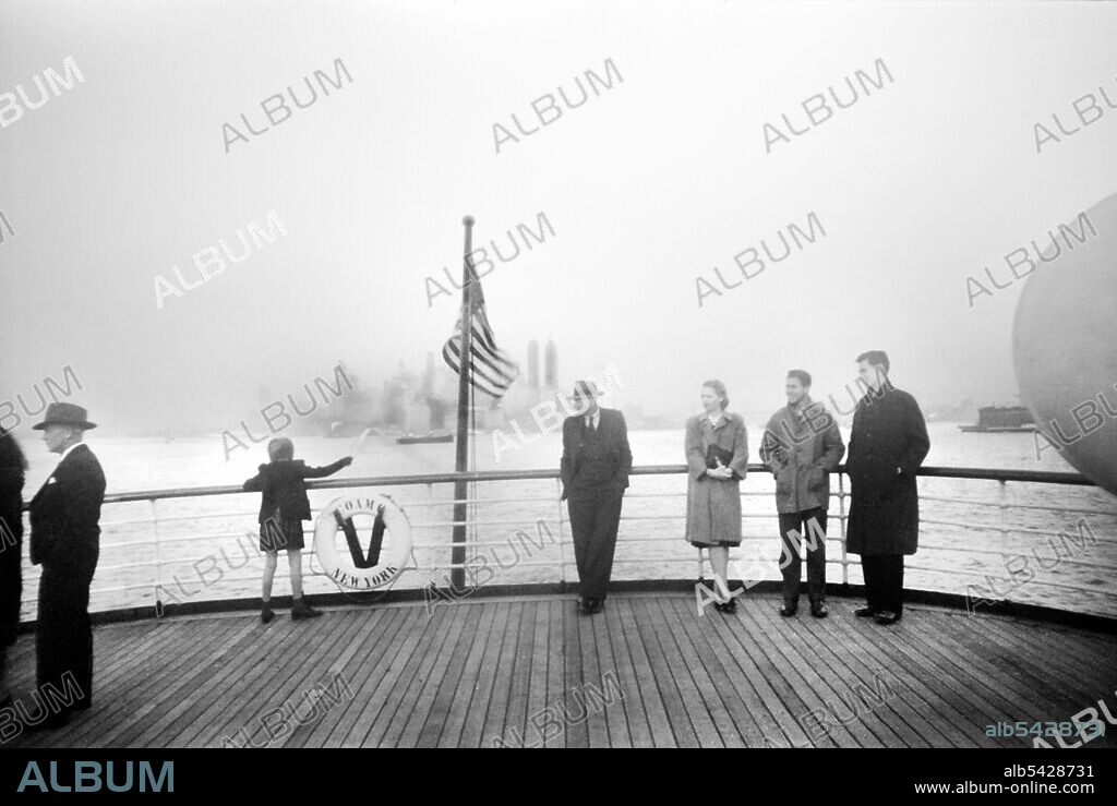 Group of People on deck of S.S. Coamo leaving New York Harbor, New York City, New York, USA, by Jack Delano for Office of War Information, December 1941.