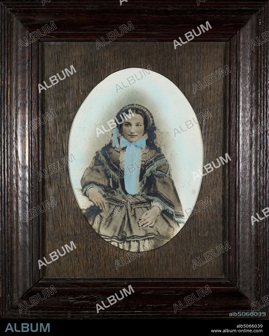 Photograph, Sarah Allen, Aston, Birmingham, 1860-80 Hand-coloured photograph. Framed by A.Charles Savage & Son, 73 Hamstead Road, Handsworth. (The photograph is earlier than the frame)., Costume, Hat, Bonnet, Victorian, Social history, Women, Portrait, Photograph, Female, Birmingham history, Costume, Fashion, Costume, Dress, Hand-Tinted.