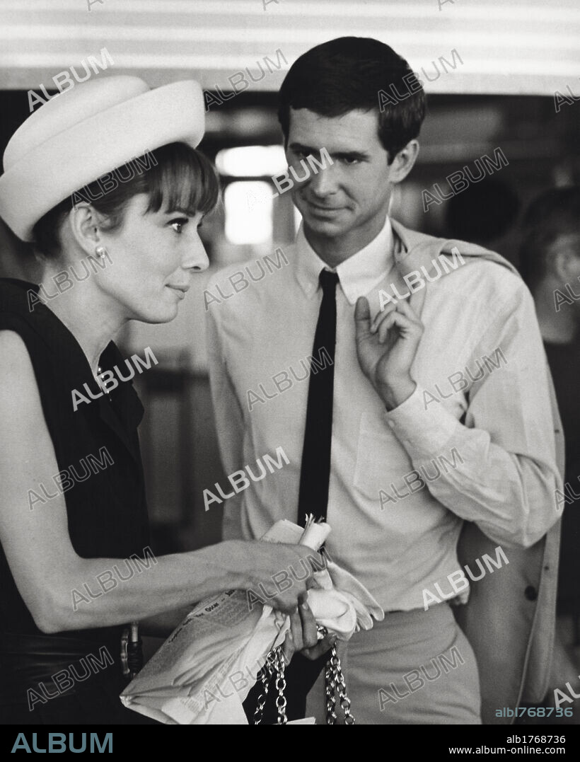 Anthony Perkins with Audrey Hepburn. The American actor Anthony Perkins looking at British actress Audrey Hepburn. Paris, July 1962.