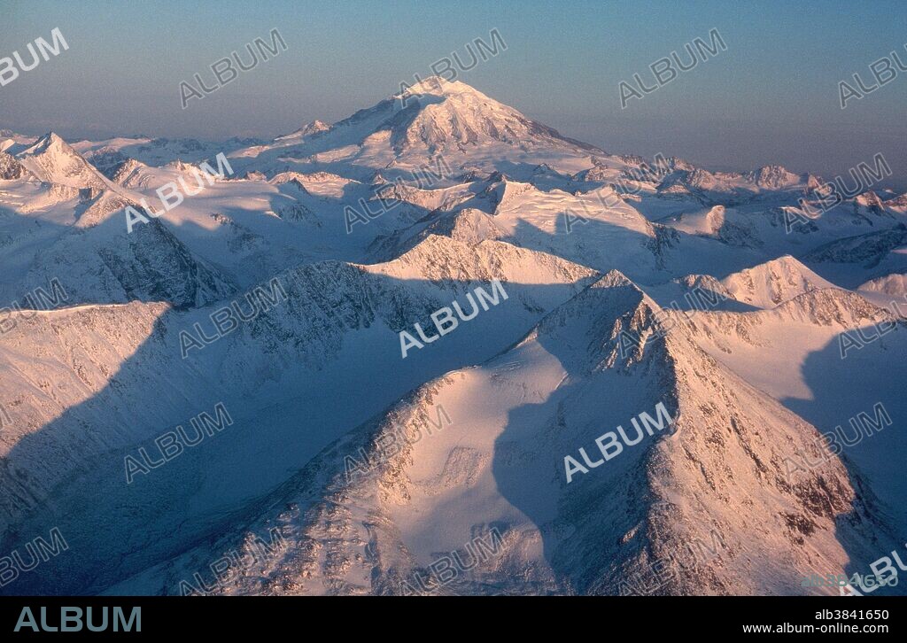 Mount Redoubt, an active volcano 10,197 feet tall that erupted between 1966-68, sending clouds of ash over 40,000 feet into the air. Chigmit Mountains, Alaska.