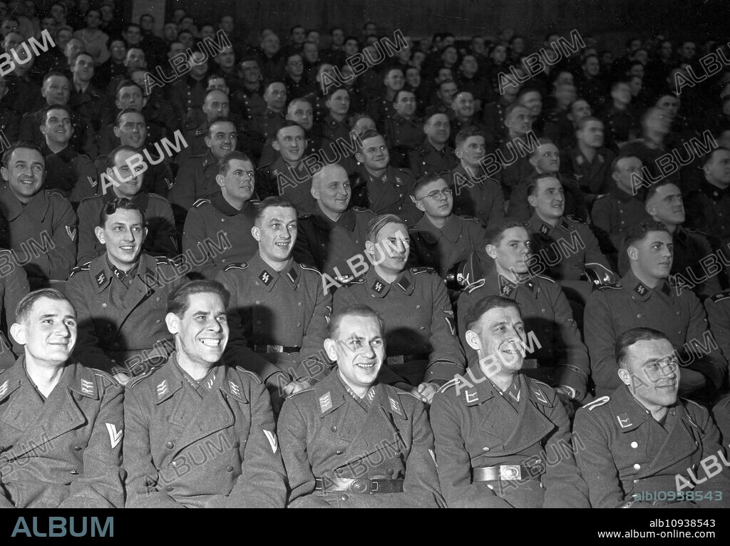 Wehrmacht and SS soldiers as audience at the "Wunschkonzert der Wehrmacht", Germany 1940s.