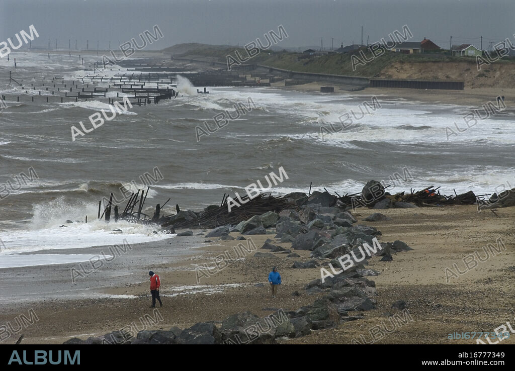 Coastal Erosion, Happisburgh on the North Norfolk coast, Britain. Managed retreat is being allowed to happen at many locations on the coast of Britain. Here at Happisburgh, looking South, the North Sea has destroyed all sea defences-seen here-, the land has been eroded away by wind and sea and homes, property and WW2 gun emplacements have fallen onto the beach from the crumbling cliff edge. COPYRIGHT PHOTOGRAPH BY BRIAN HARRIS © 2008. 07808-579804.