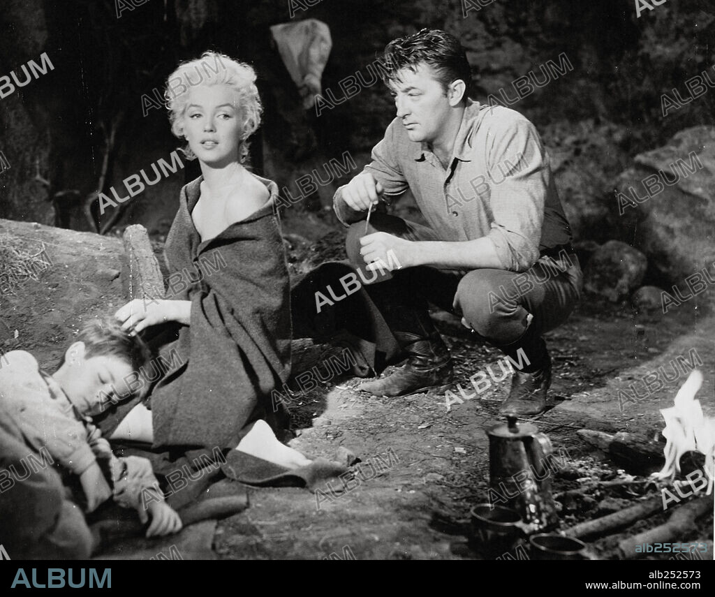 NORMA JEAN BAKER und ROBERT MITCHUM. MARILYN MONROE und ROBERT MITCHUM in RIVER OF NO RETURN, 1954, unter der Regie von OTTO PREMINGER. Copyright 20TH CENTURY FOX.