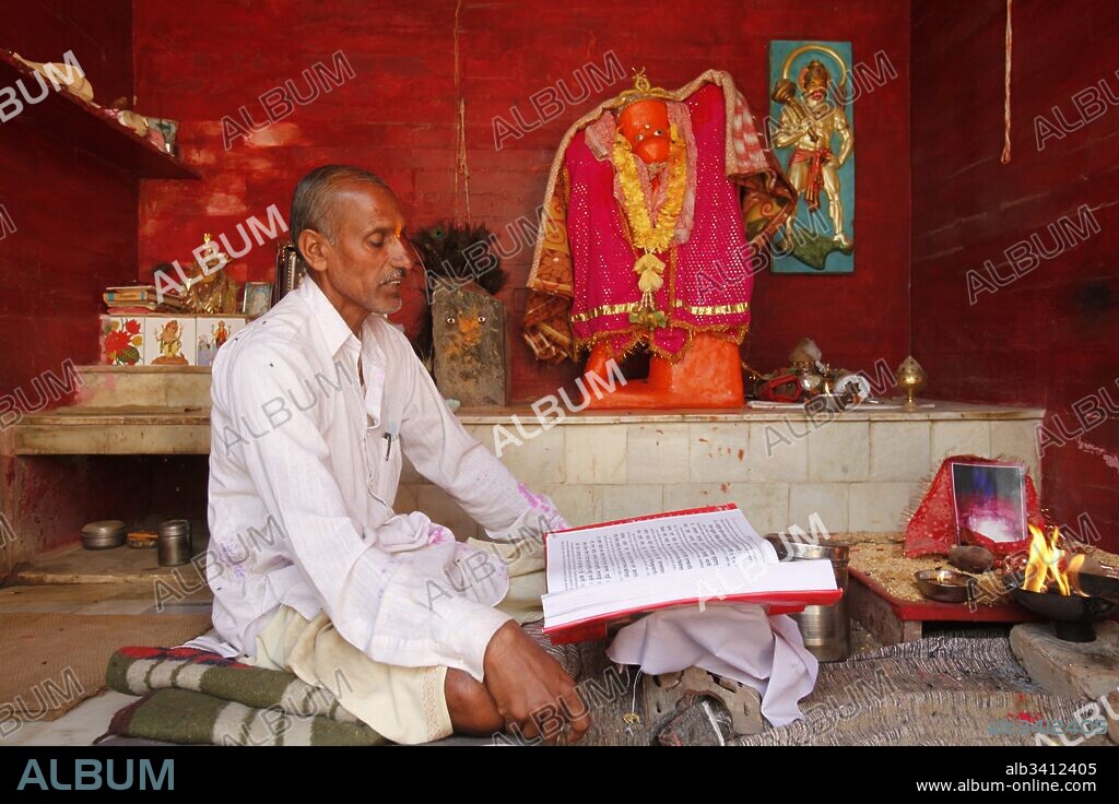 Hindu priest reading the Ramayana, The temple is located on the Goverdan Parikrama pilgrimage trail.