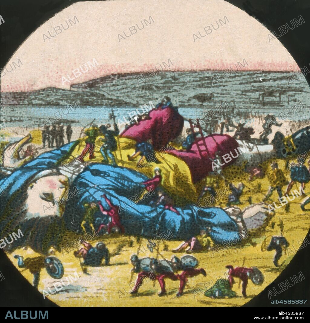 Gulliver is tied up by the Lilliputians, lantern slide, late 19th century. 'I attempted to rise, but was not able to stir: for, as I happened to lie on my back, I found my arms and legs were strongly fastened on each side to the ground; and my hair, which was long and thick, tied down in the same manner'. A scene from "Gulliver's Travels" by Jonathan Swift, first published in 1726. One of a series of 12 'Superior Lithographic Coloured Lantern Slides...with Lecture complete', made in England c1870-1900.