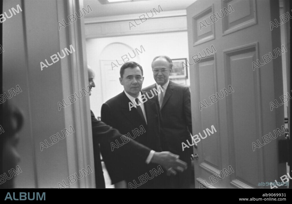 Soviet foreign minister Andrei Gromyko and Soviet Ambassador to the United States, Anatoly F. Dobrynin, walking through a door way at the White House in Washington, D.C. during the Cuban missile crisis.