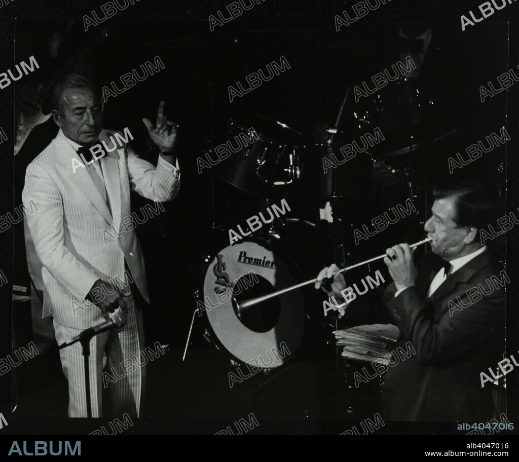 Dance band leader Joe Loss (left) on stage at the Forum Theatre, Hatfield, Hertfordshire, 2 May 1986.