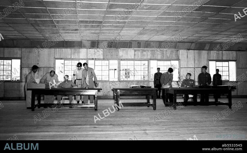General William K. Harrison, Jr., seated at left, and North Korean General Nam Il, seated at right, sign armistice documents in Armistice Hall in Panmunjom, a no-man's-land between the Koreas. The 1953 Korean armistice agreement did stop the fighting, but no final peace treaty was signed.