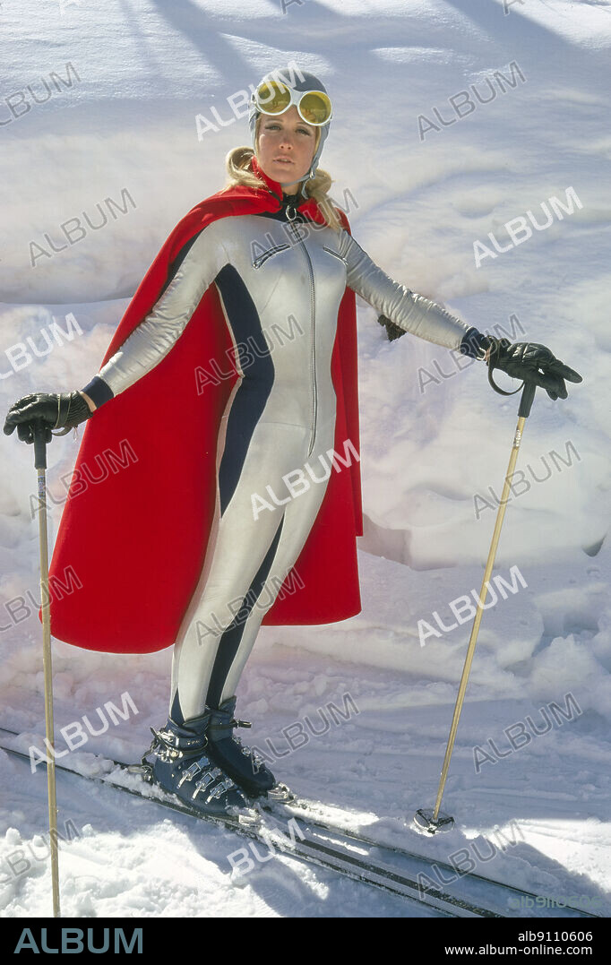 American Skier Suzy Chaffee, full-length Portrait wearing Ski Outfit and Cape, Vail, Colorado, USA, Toni Frissell Collection, November 1969.