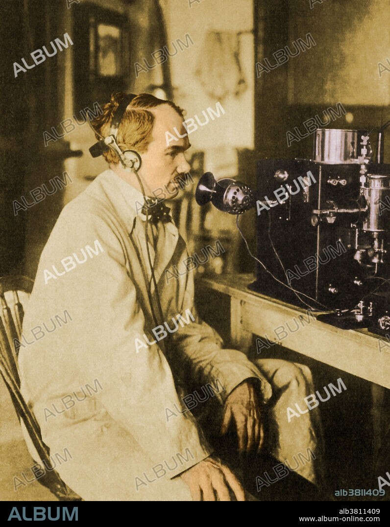 Lee De Forest (1873-1961), seated at his invention, the radio-telephone, called the audion, a vacuum tube that takes weak electrical signals and amplifies them. Lee De Forest was a prolific American inventor, who was granted over 180 patents, and is credited with helping bring sound to movies.