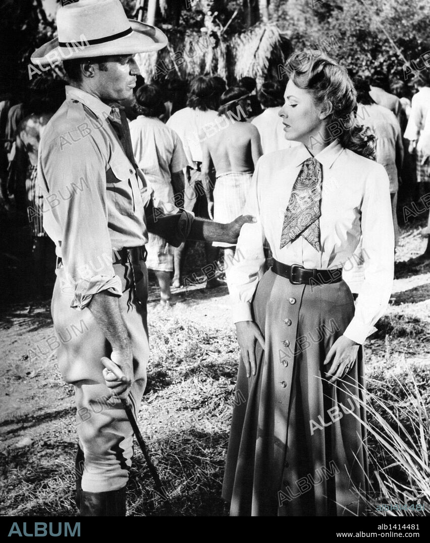 Eleanor Jane Parker and CHARLTON HESTON. CHARLTON HESTON and ELEANOR PARKER in THE NAKED JUNGLE, 1954, directed by BYRON HASKIN. Copyright PARAMOUNT PICTURES.
