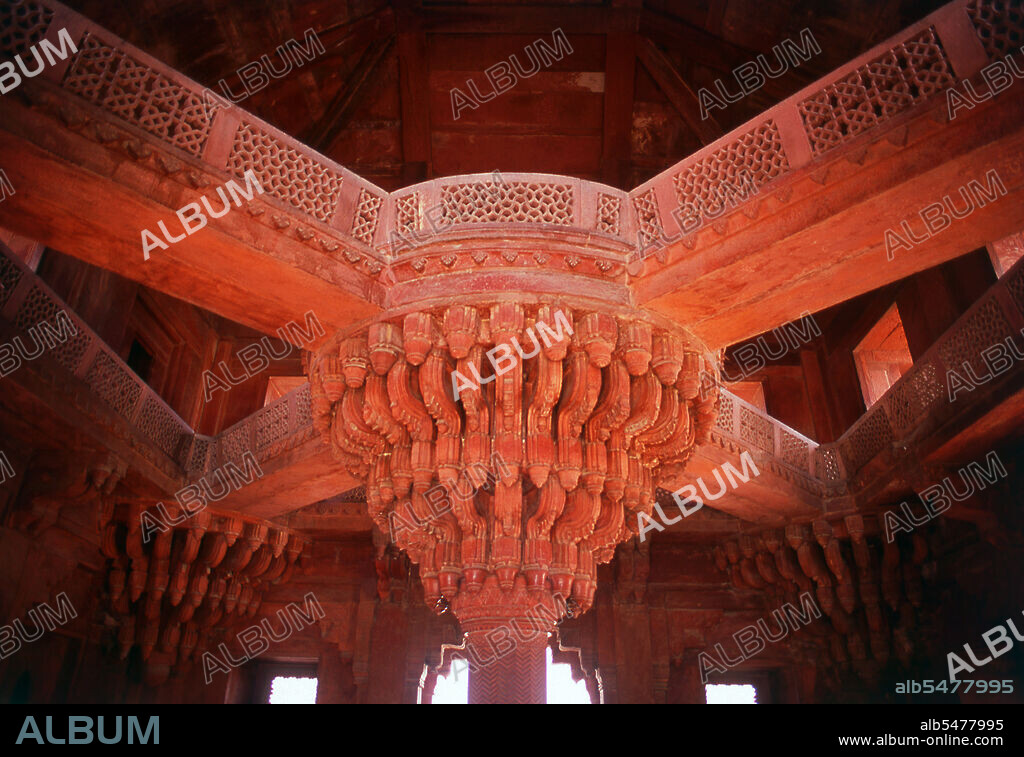The Diwan-i-Khas, or Hall of Private Audience, is a plain square building with four chhatris on the roof. It is famous for its central pillar, which has a square base and an octagonal shaft, both carved with bands of geometric and floral designs, further its thirty-six serpentine brackets support a circular platform for the Mughal emperor Akbar, which is connected to each corner of the building on the first floor, by four stone walkways. It is here that Akbar had representatives of different religions discuss their faiths and gave private audience. Fatehpur Sikri (the City of Victory) was built during the second half of the 16th century by the Emperor Akbar (r. 1556-1605). It was the capital of the Mughal Empire for 10 years.