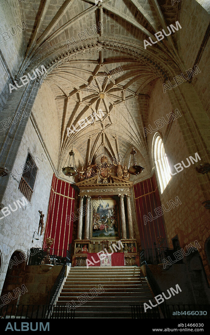 Gothic art. Interior of the Church of the Monastery of San Jeronimo de Yuste (15th century). Single nave with starry tiercerons vaults on polygonal head. In the background the altarpiece by Juan de Herrera (1580). Caceres province. Extremadura. Spain.