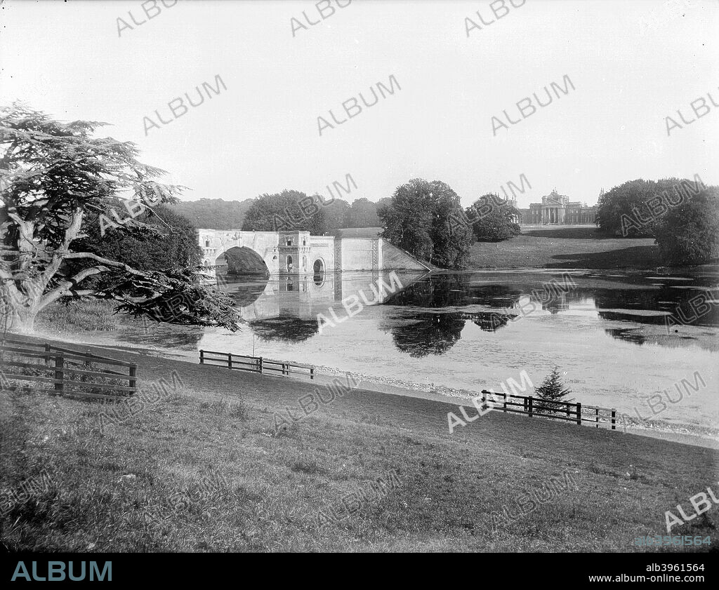 The Grand Bridge, built by Vanburgh, at Blenheim Palace, Woodstock, Oxfordshire, 1890. Taken from the north bank of the lake with the 18th century palace in the background.