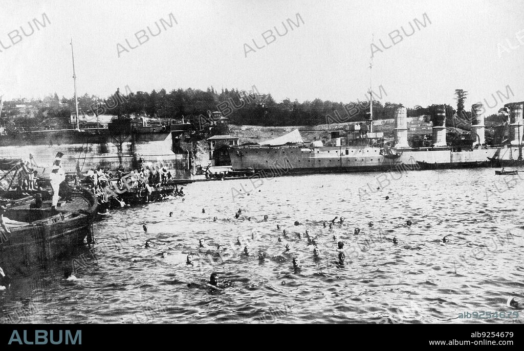 The German cruiser SMS Breslau in the harbour of Stenia during the First World War. Swimmers in the harbour basin. (Date created: 01.12.1916-31.12.1916).
