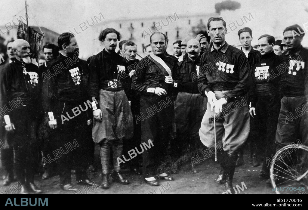 Benito Mussolini among the quadrumvirs that will be planning the March on Rome. At the Arenaccia, the future head of the Fascist government Benito Mussolini assembling the quadrumvirs among which we find Michele Bianchi, first Secretary of the National Fascist Party (PNF). A few days later they would be leading the March on Rome. Naples, 24th October 1922.