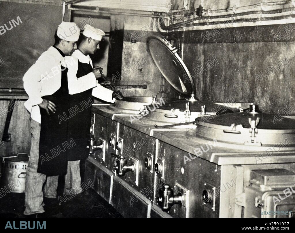 World War Two, French military cooks prepare a meal in a kitchen, within the Maginot Line, France 1940.