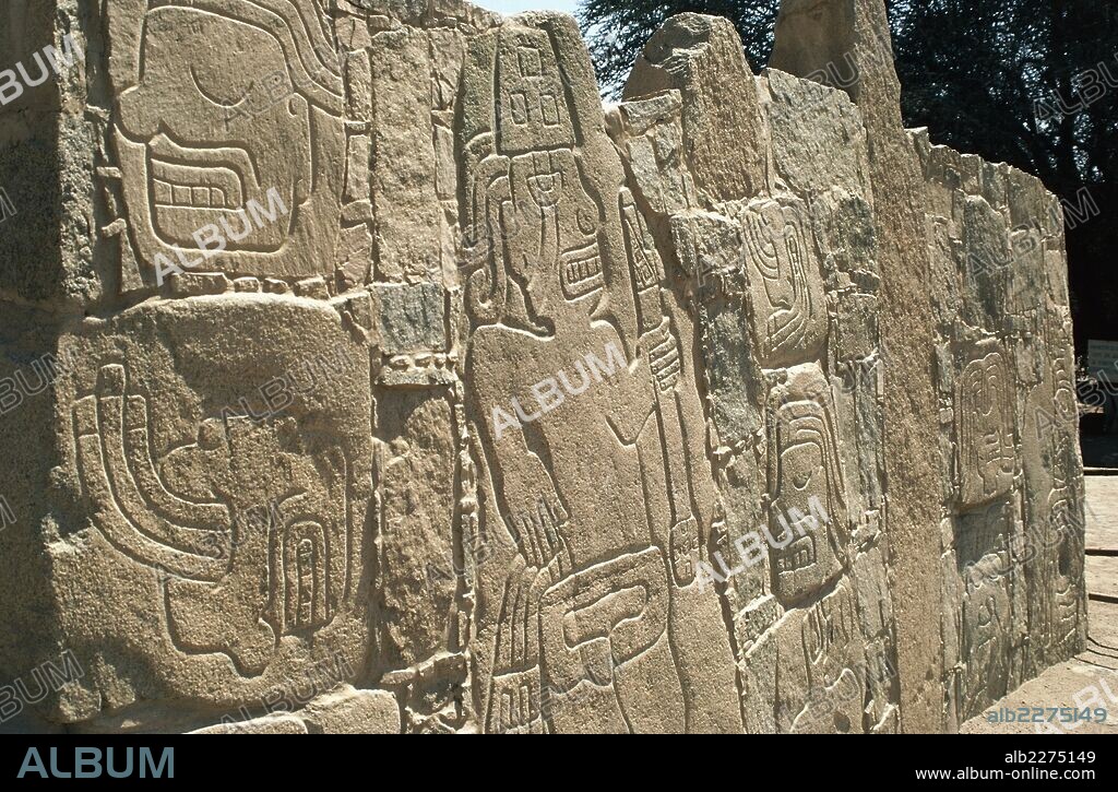 Walls with carvings of warriors, archaeological site of Cerro Sechin, Andean Highlands, Peru. Chavin Culture, first millennium BC.