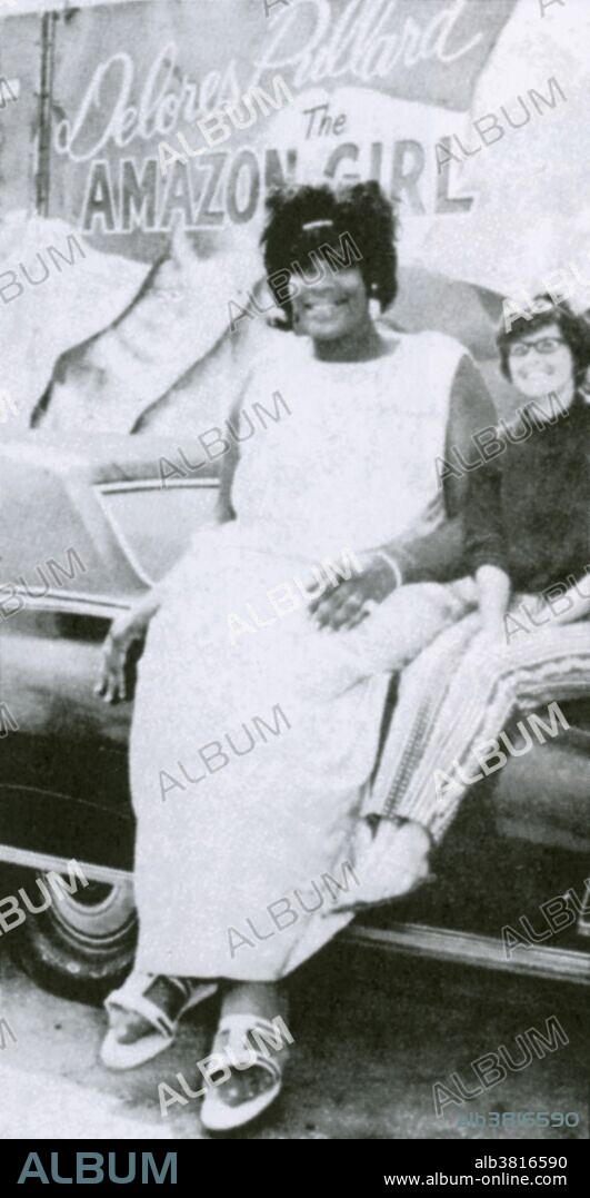 Delores Ann Pullard (August 13, 1946 - May 19, 1971) joined the Walter Wamous sideshow when she was 19, was billed as "The Tallest Woman in the World" and claimed to be 8 feet 1 inch tall, though her medically recorded height was 7 feet 5.5 inches. She weighed 431 pounds and wore size 23 shoes. After about 3 years working for the sideshow she married James Johnson. She underwent surgery to remove a tumor in the pituitary gland at the base of her brain. Although it was initially thought that she was in satisfactory condition after the operation, she never recovered and her died at the age of 24.