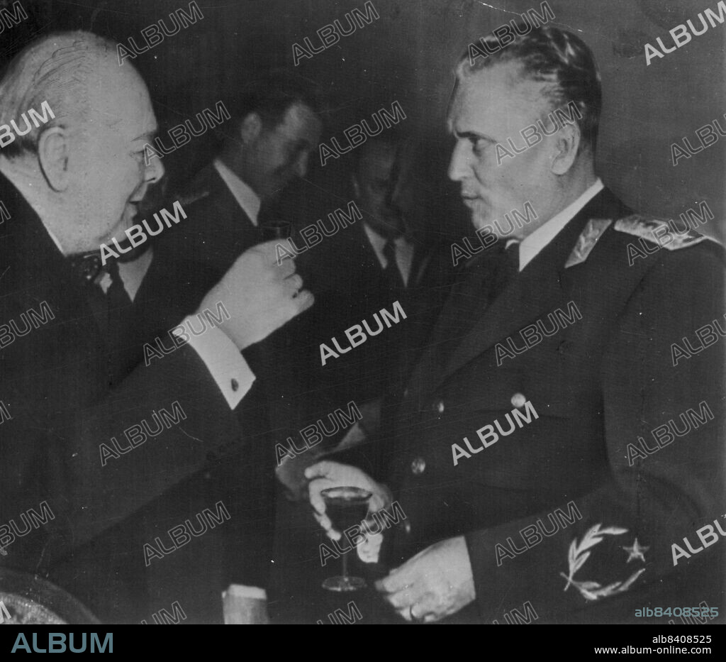 Toast To Tito -- British Prime Minister Winston Churchill raises a glass to his host, Yugoslav President Tito, before a luncheon at the Yugoslav embassy in London today.The two statesmen met earlier in the day to discuss ways in which Tito's anti-Soviet state can ward off possible Russian aggression. March 19, 1953. (Photo by AP Wirephoto).