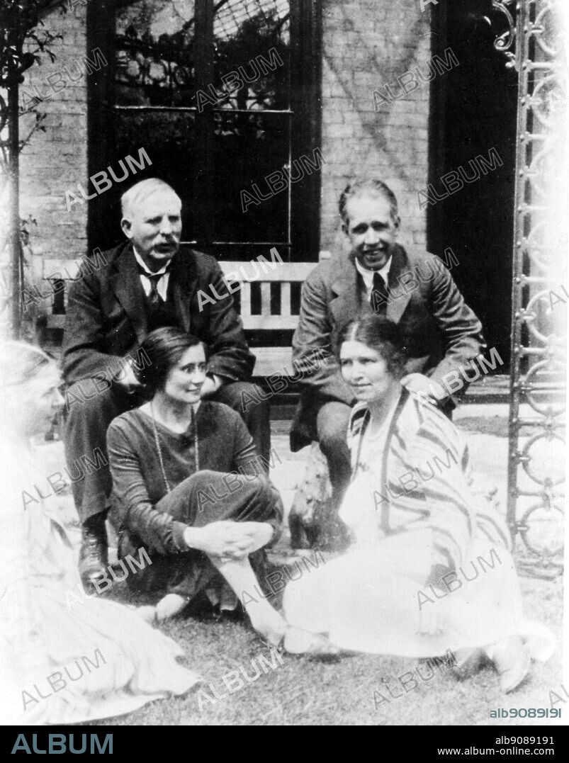 Lord Ernest Rutherford (1871-1937) and Lady Rutherford, Niels Bohr and Mrs Bohr. Rutherford was an English physicist who investigated radioactivity and the structure of atoms.