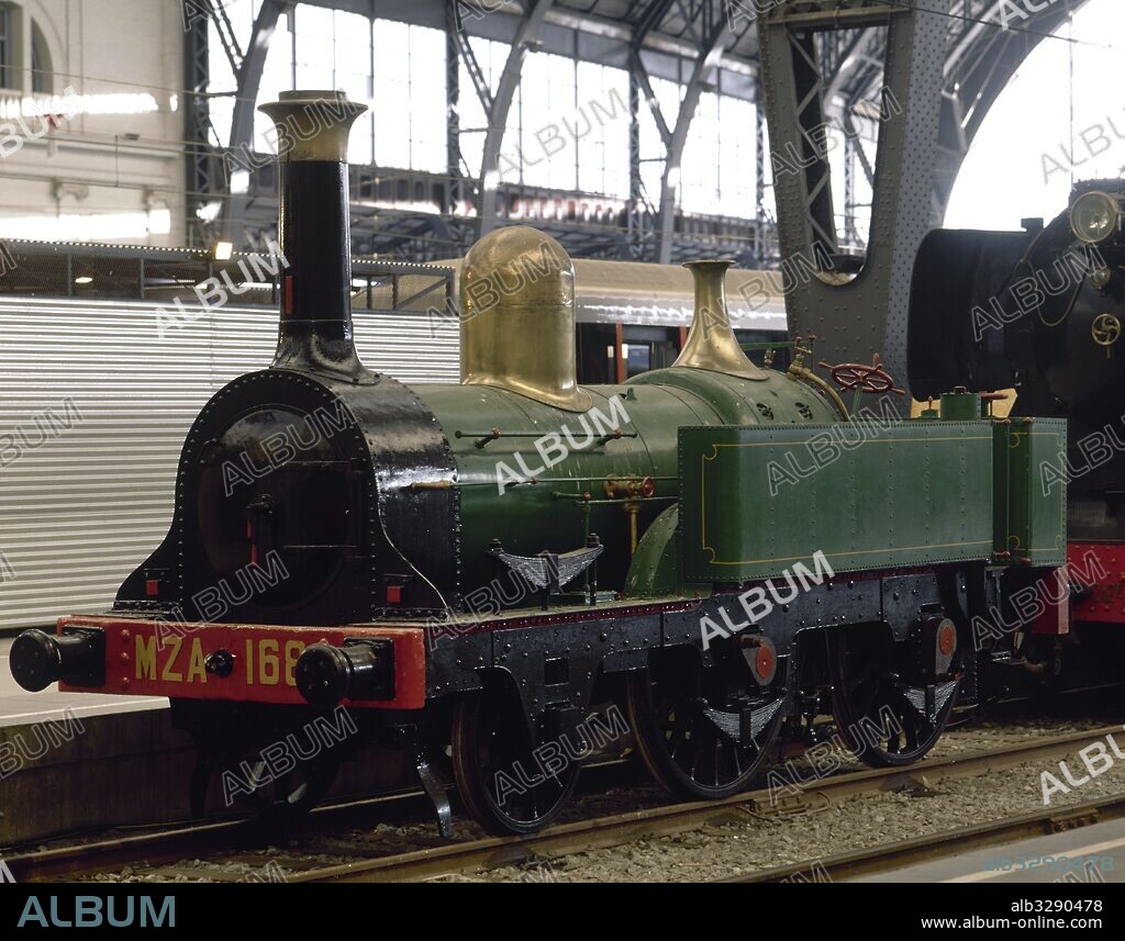 LOCOMOTORA MZA 168. La más antigua que se conserva en España. Encargada por el ferrocarril de Barcelona-Martorell. Empezó a prestar servicio en 1851. Retirada del servicio en los años 20. MAQUINA-TENDER de vapor tipo 12 Tn. 630 CV. 26,3 Tn. 8,23 m. Exposición "150 años de ferrocarril" celebrada en la Estación de Francia de Barcelona (1998-1999). Cataluña.